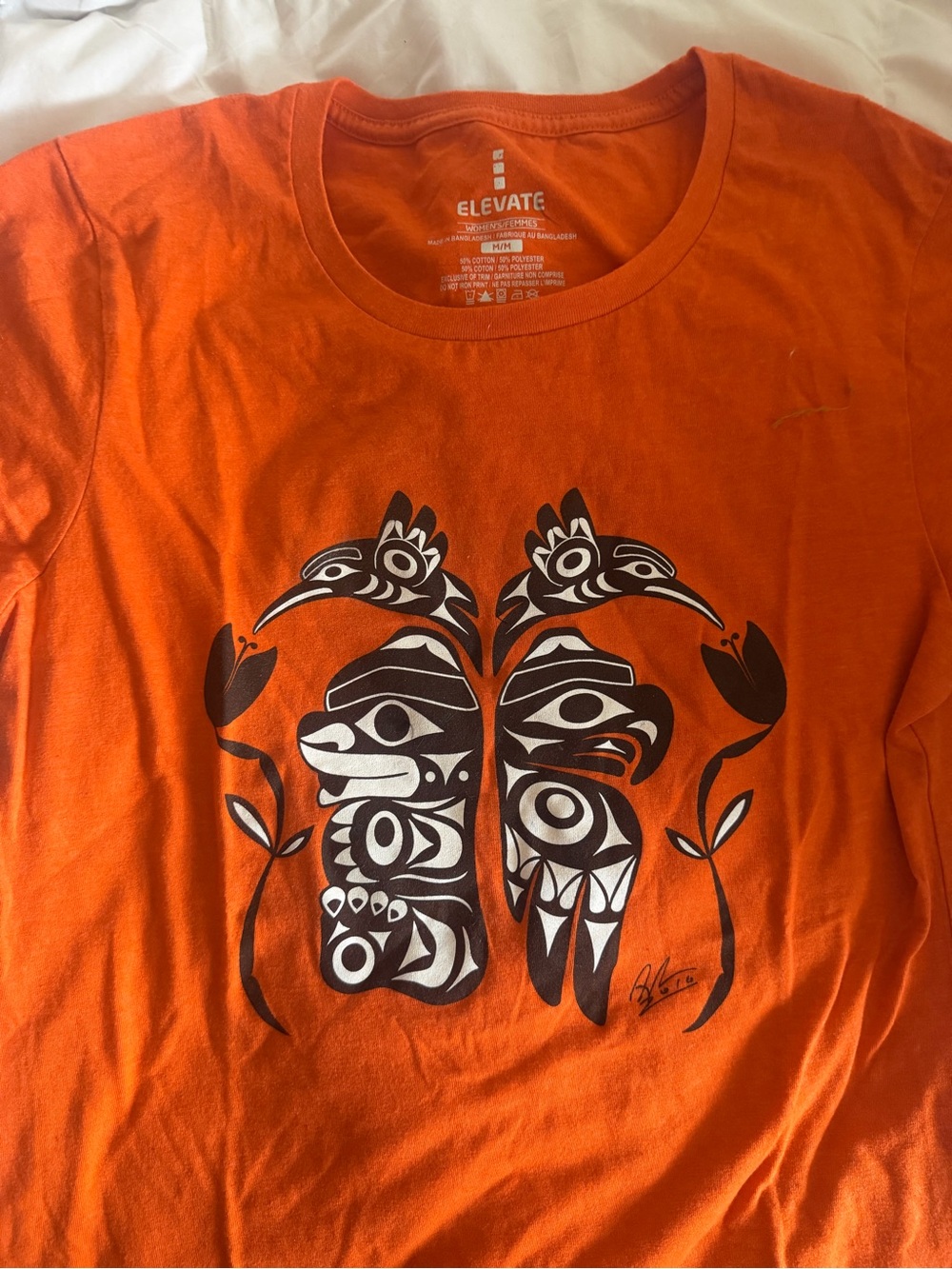 🪶 Elevate Orange Graphic Tee with Tribal Print “Every Child Matters”